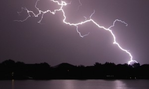 Lightning Striking Ground Near Residential Lake